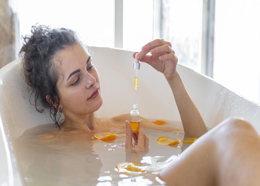 femme-qui-prend-un-bain-aux-huiles-essentielles
